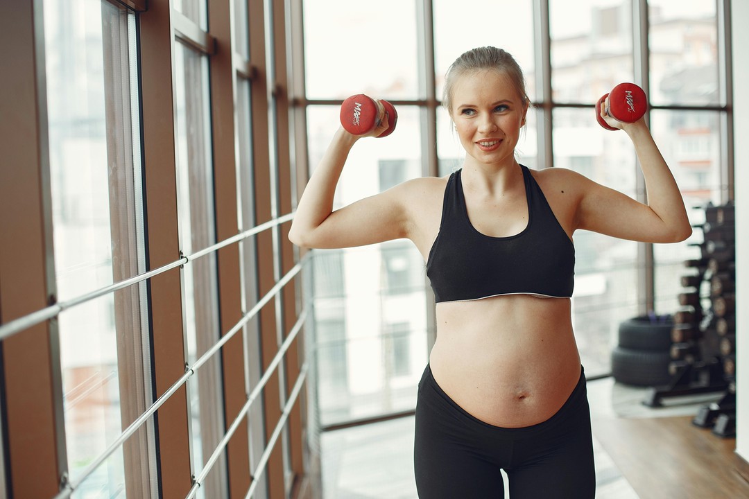 A pregnant woman working out